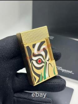 S. T. Dupont presents a limited edition tiger-eye art-gold double striker lighter