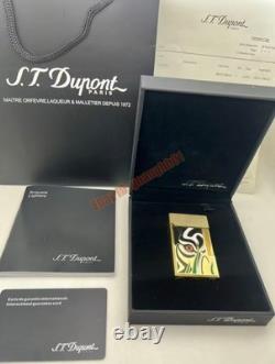 S. T. Dupont presents a limited edition tiger-eye art-gold double striker lighter