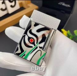 S. T. Dupont presents limited edition tiger-eye art-silver double striker lighter