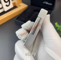 S. T. Dupont présente le briquet double frappe en argent art avec édition limitée œil de tigre